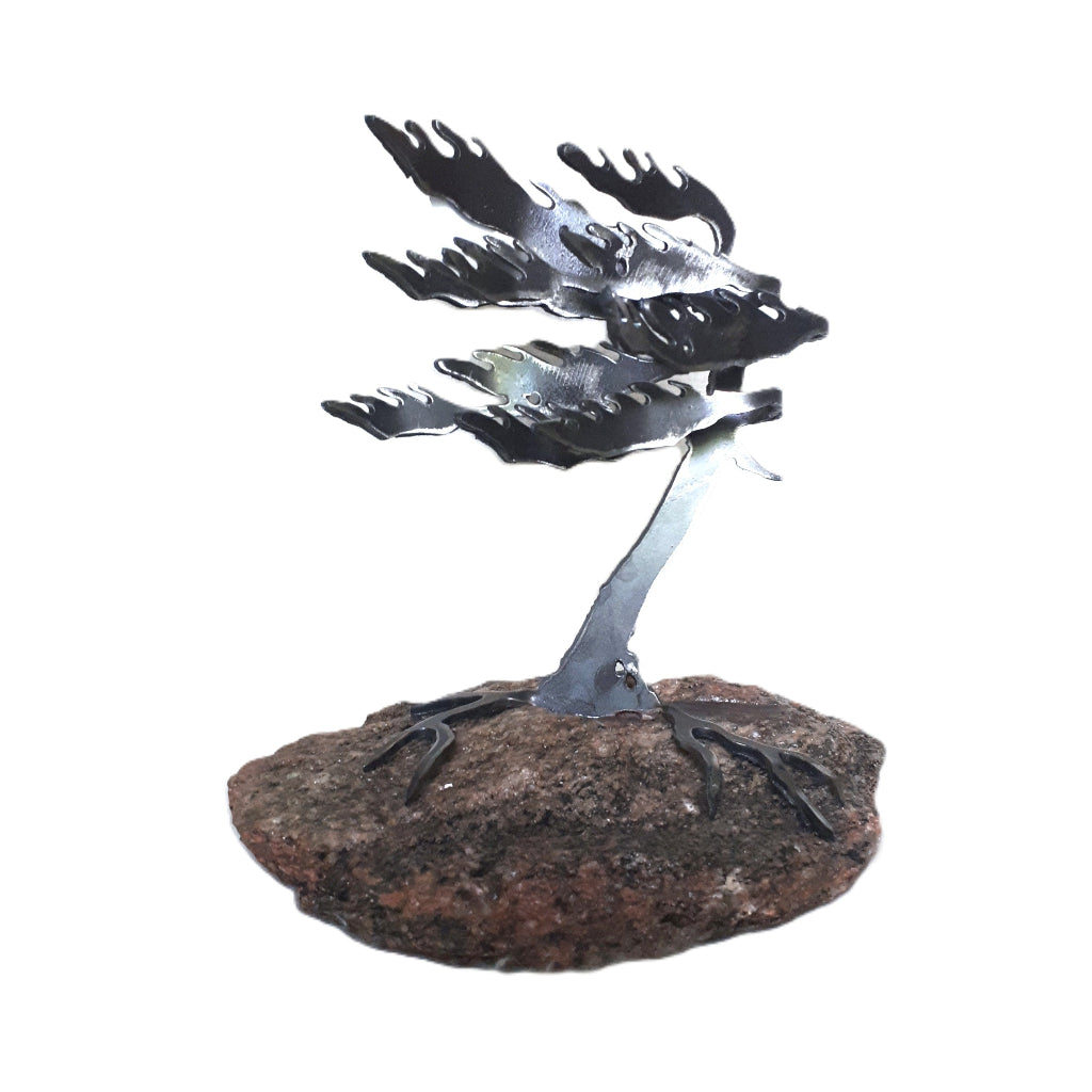 Metal white pine sculpture on piece of Canadian granite