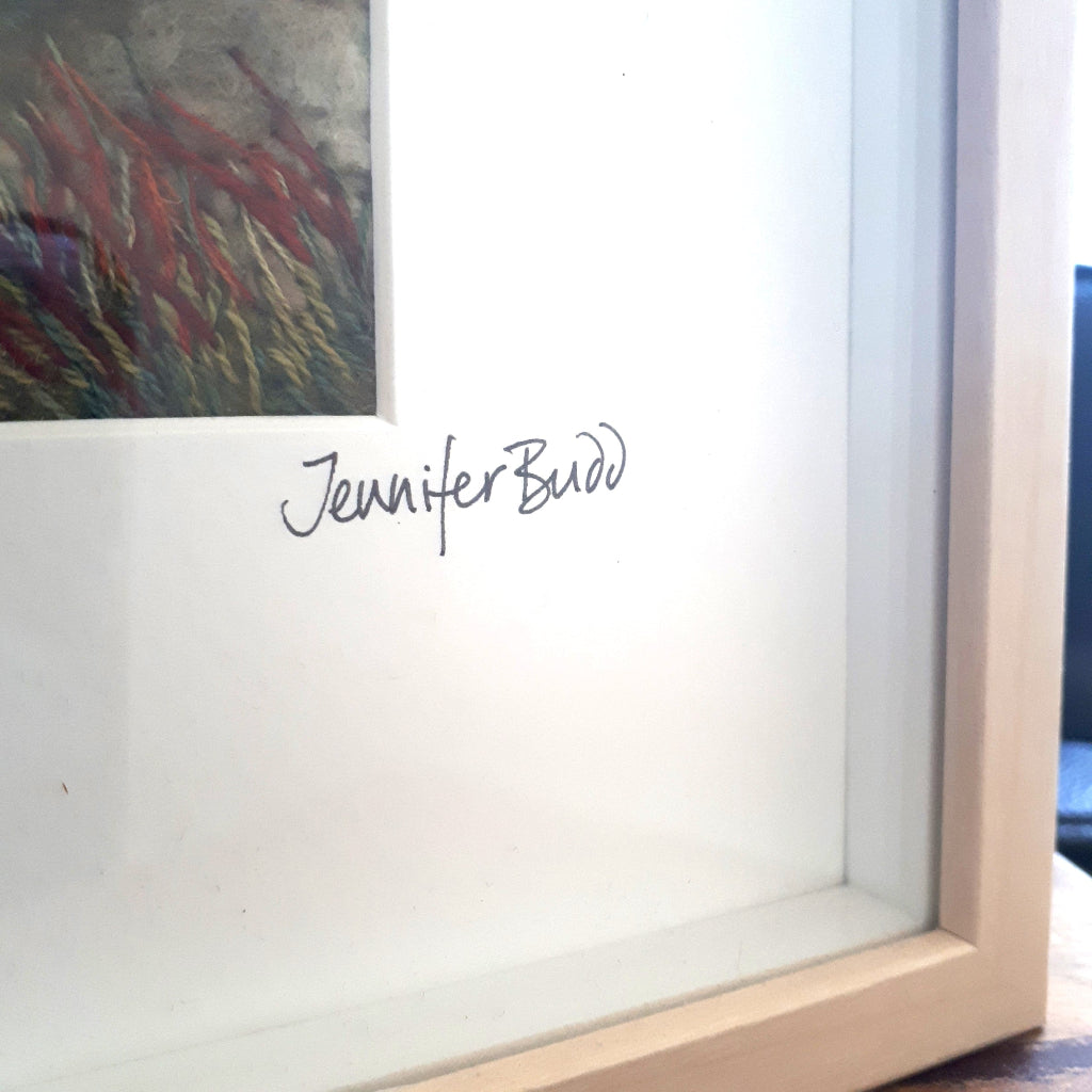 Framed felt artwork with 'Jennifer Budd' signature on a white background