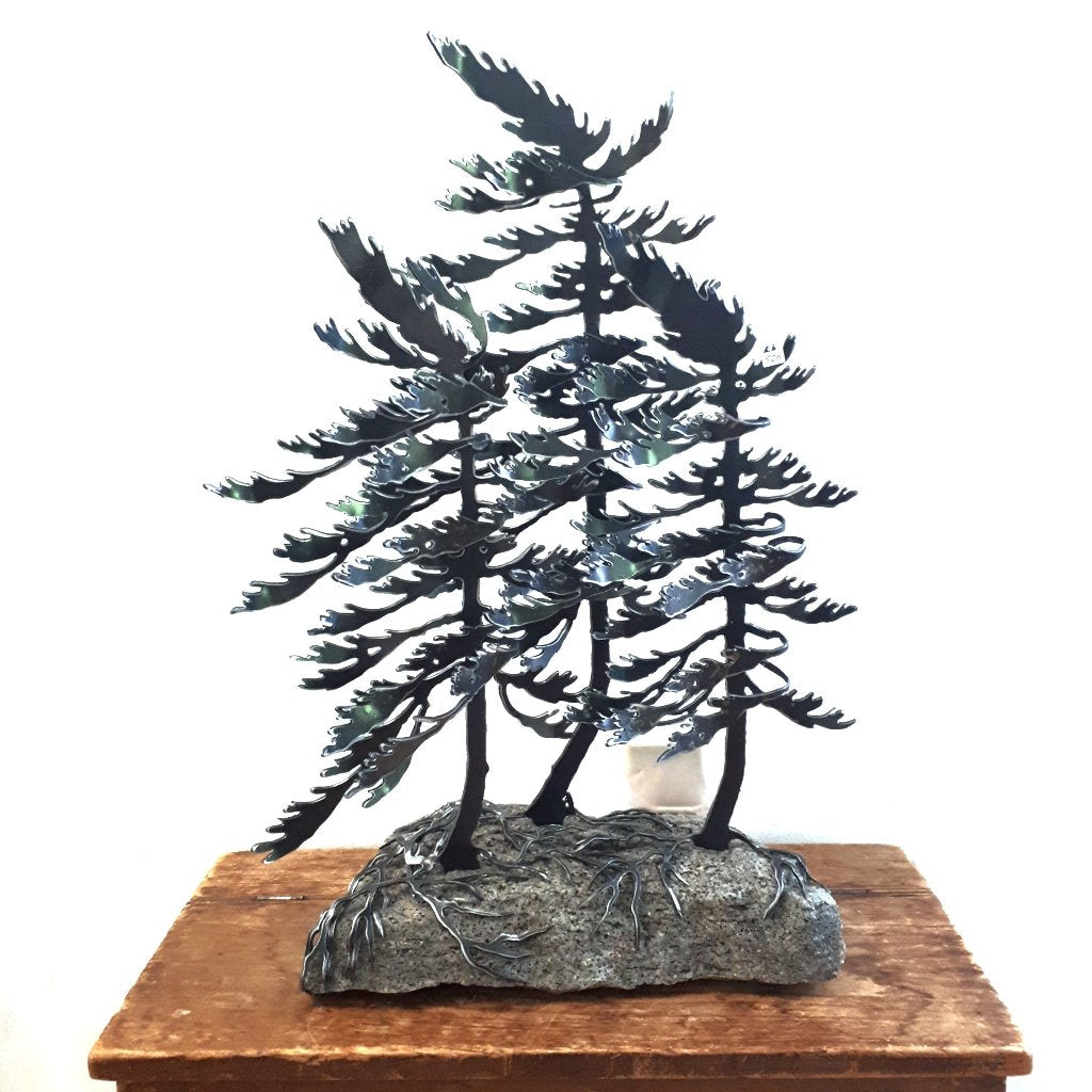 Steel Triple Tree Sculpture on Canadian Rock