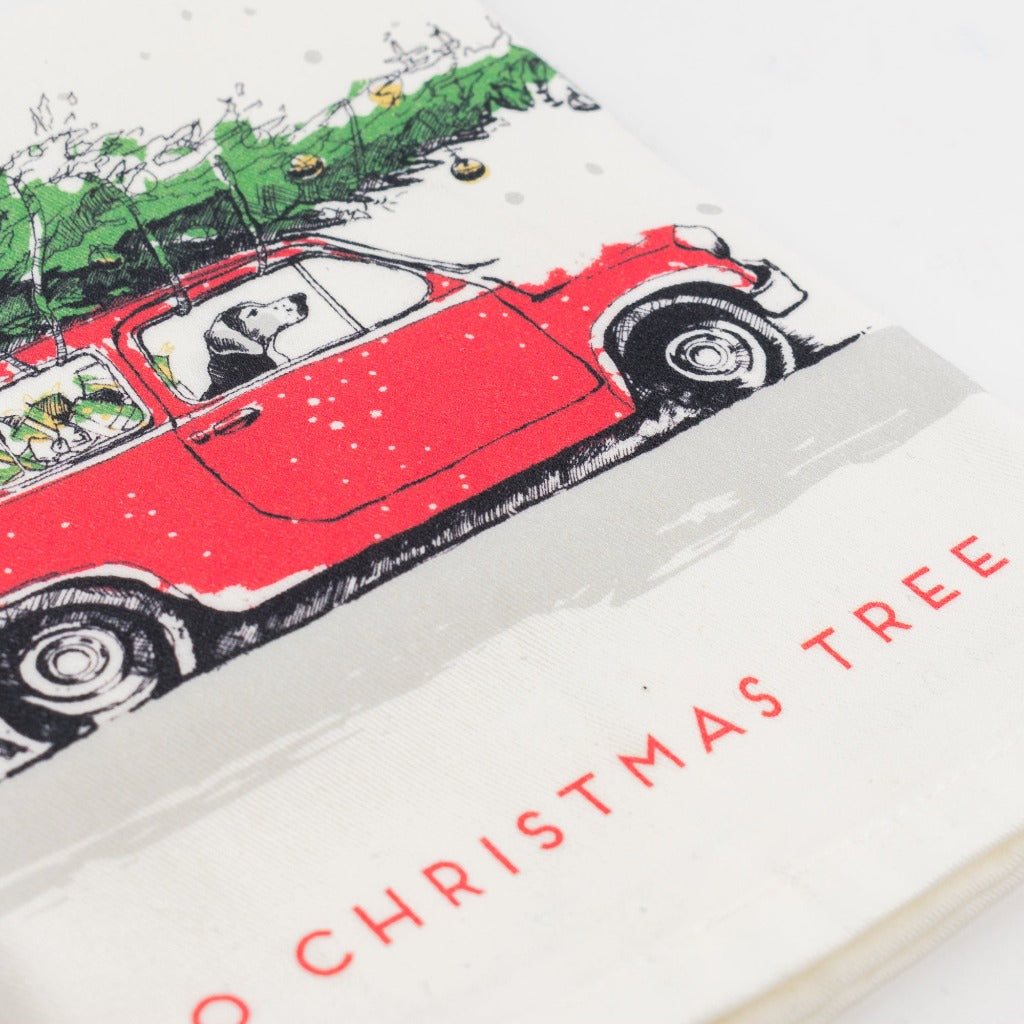 Tea Towel - Dog Driving Car with Christmas Tree on Top