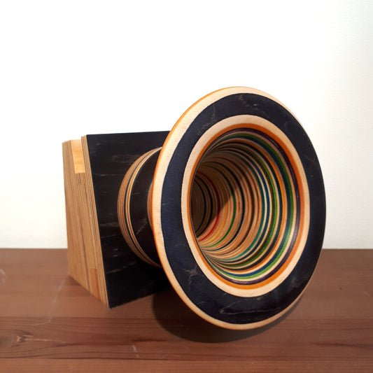 Wooden speaker made from skateboards, for use with a device playing music eg. phone, tablet 
