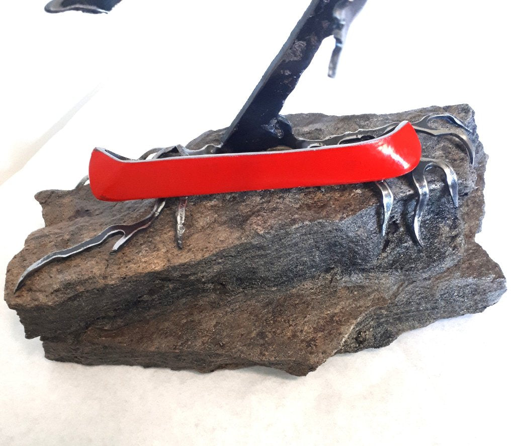 Steel Tree Sculpture with Red Canoe (300) on Canadian Rock